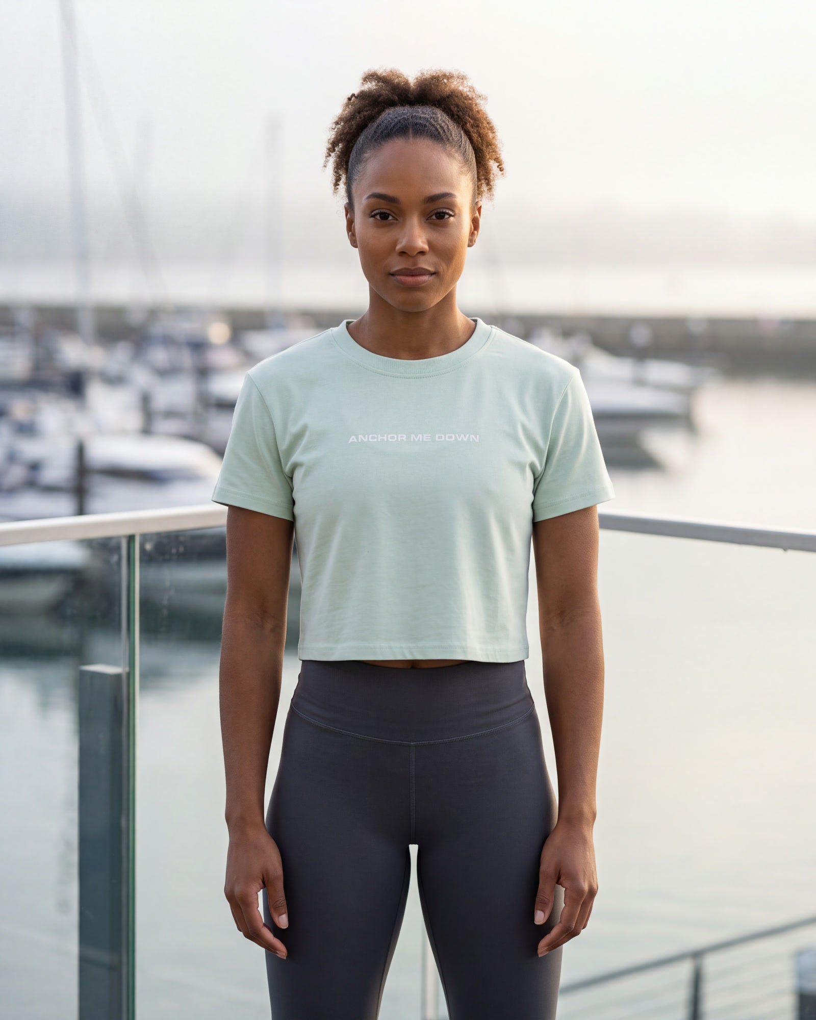 Model wearing AMD Circle Baby Tee — Blue in the Anchor Me Down campaign