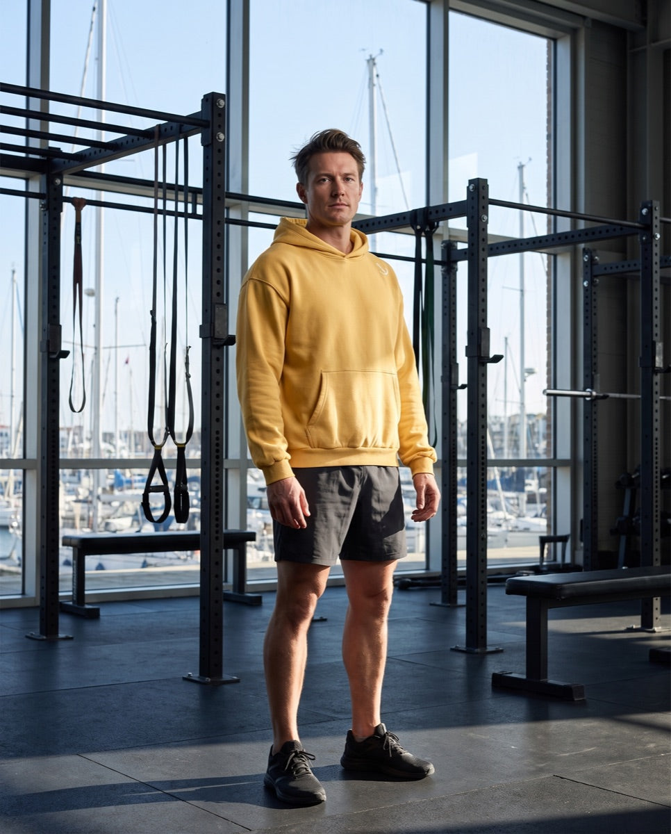 Model wearing Mini Anchor Hoodie — Brights B in the Anchor Me Down campaign
